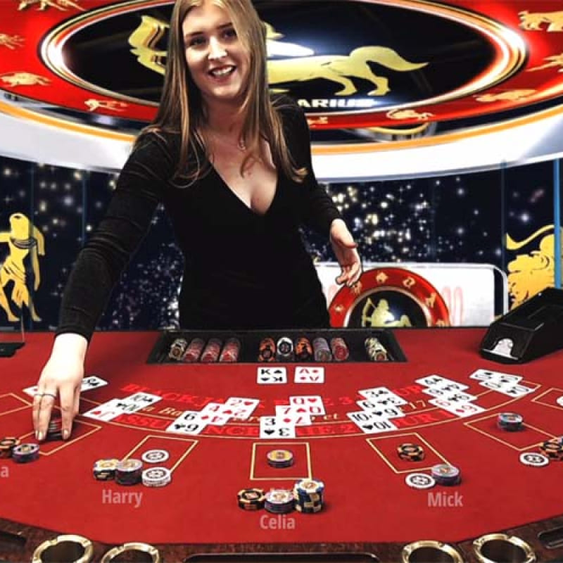 Friendly South Asian dealer smiling at a 299bet Baccarat table
